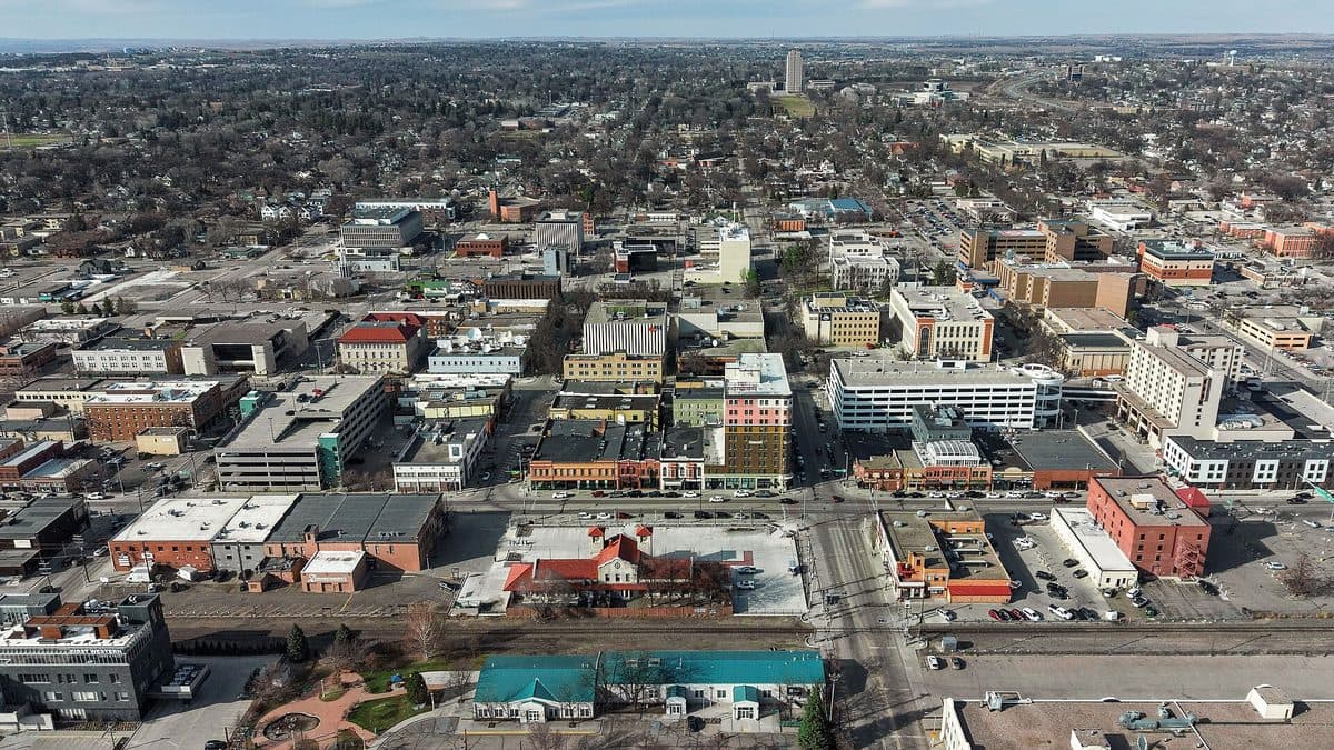 An aerial view of downtown Bismarck with residential streets stretching to the horizon